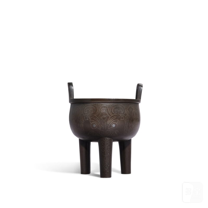 A silver-inlaid bronze 'mask' tripod incense burner, ding, Early Qing dynasty | 清早期 銅錯銀獸面紋鼎式爐